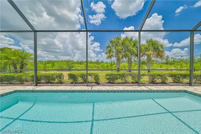 19828 Beverly Park Road, House other with 3 bedrooms, 3 bathrooms and null parking in Estero FL | Image 2