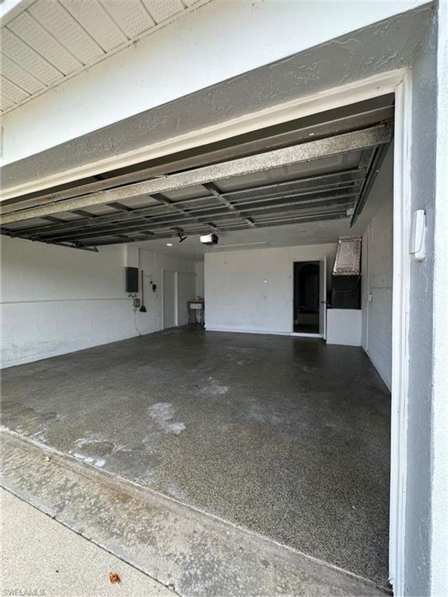 Garage with a garage door opener | Image 23