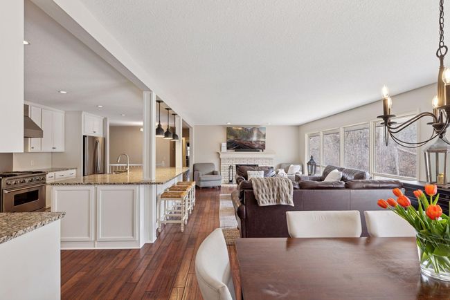 Living Room has wood burning fireplace. | Image 9