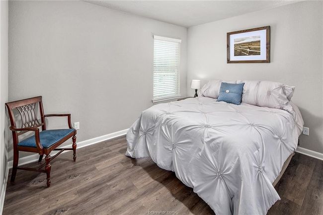 Bedroom featuring dark hardwood / wood-style floors | Image 16