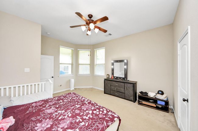 Primary bedroom on first floor with bay windows | Image 15