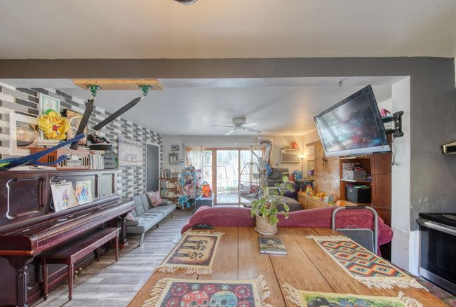 Dining room featuring a ceiling fan and wood finished floors | Image 5