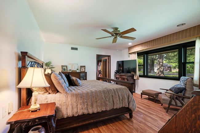 Bedroom with wood finished floors, recessed lighting, and a ceiling fan | Image 17