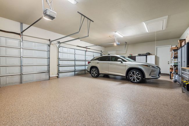 Garage featuring a garage door opener | Image 38