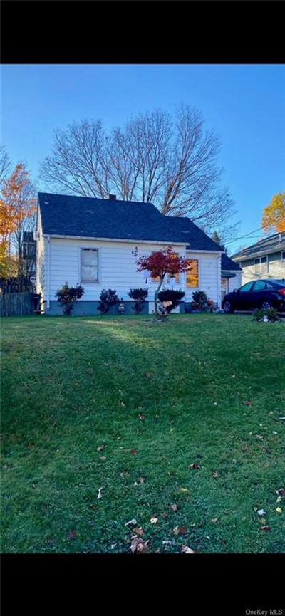 Rear view of house with a lawn | Image 1