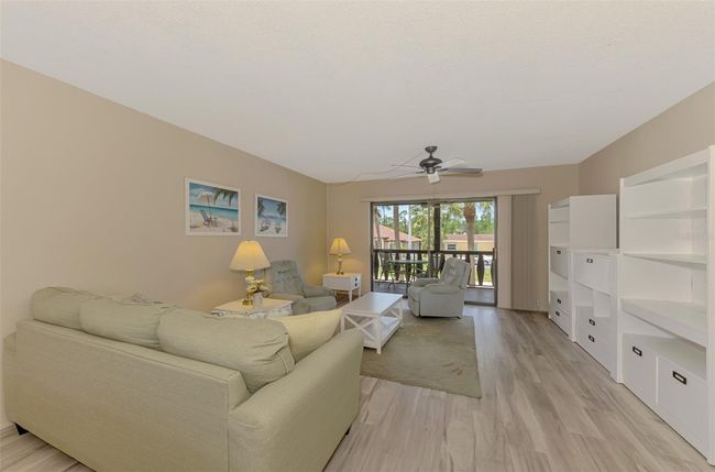 Living Room view, spacious with storage, partially furnished. | Image 13