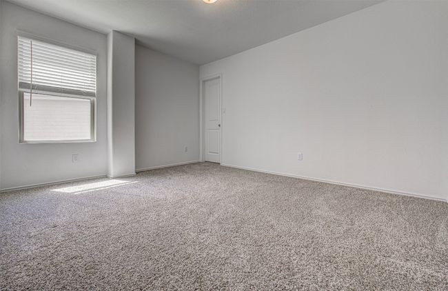 Carpeted spare room featuring baseboards | Image 22