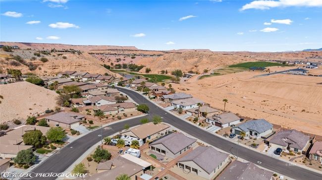 Aerial overview of property's location featuring a mountain backdrop and nearby suburban area | Image 66