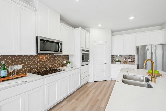 Kitchen with white cabinetry, and recessed lighting | Image 5