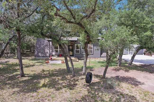 Obstructed view of property featuring a front lawn | Image 27