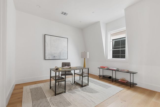 The bedroom features hardwood floors and a built out walk-in closet. (Shown here as a home office). | Image 29
