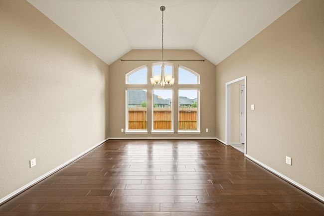 formal dining room and flex room with wood floors. | Image 4
