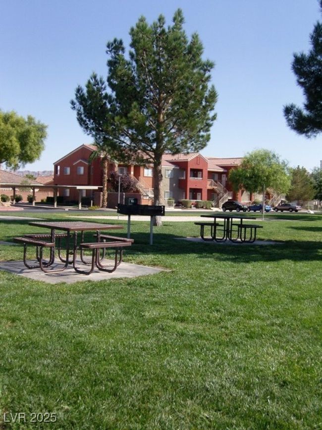 View of community featuring a lawn | Image 13