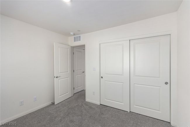 Unfurnished bedroom featuring a closet, carpet, visible vents, and baseboards | Image 23