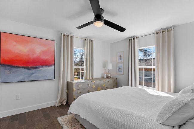 Bedroom with dark hardwood / wood-style floors and ceiling fan | Image 36