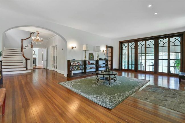 Appointed with graceful archways and palladium french doors | Image 6
