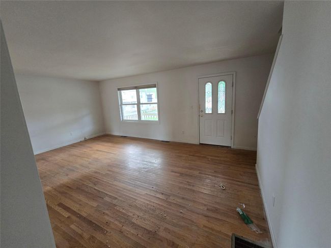 Entryway featuring wood-type flooring and baseboards | Image 8