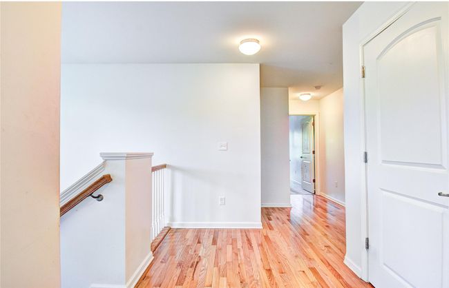Hallway featuring an upstairs landing, hardwood flooring | Image 13