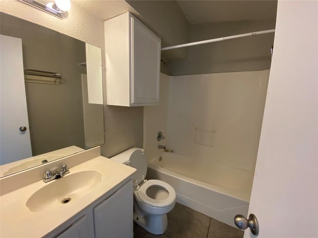This is a view of the bathroom. Notice the tub/shower combination. | Image 7