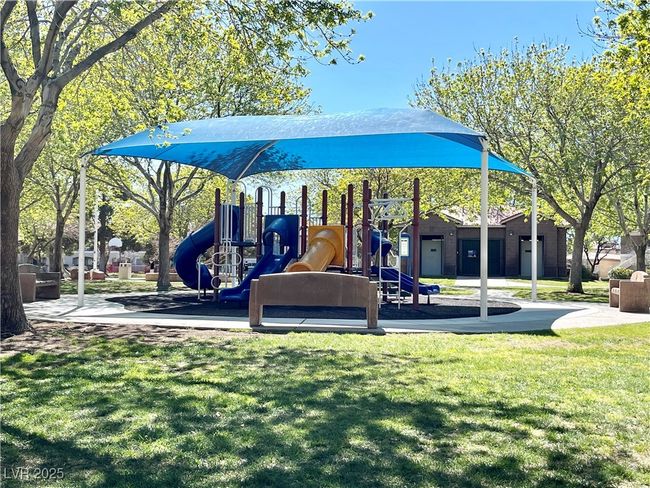 Communal playground featuring a yard | Image 58