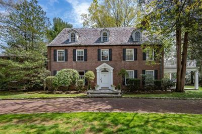 Colonial inspired home featuring a front lawn | Image 1