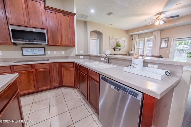 11760 Huckleberry Trl E, House other with 4 bedrooms, 2 bathrooms and null parking in MACCLENNY FL | Image 11