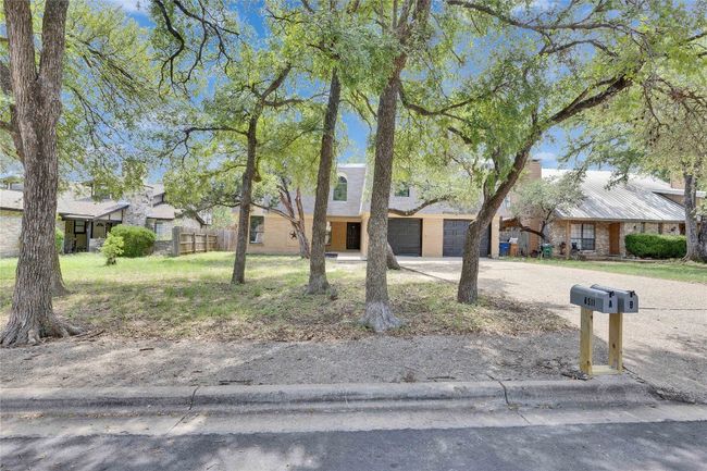 Front of duplex with lots of trees. | Image 17