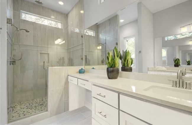 Bathroom with vanity, recessed lighting, a stall shower, and tile patterned flooring | Image 17