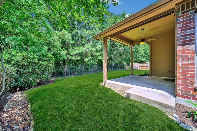 The deep covered patio is perfect for all-weather enjoyment. | Image 28