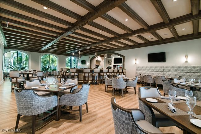 Dining area featuring coffered ceiling, beam ceiling, and light wood-type flooring | Image 29