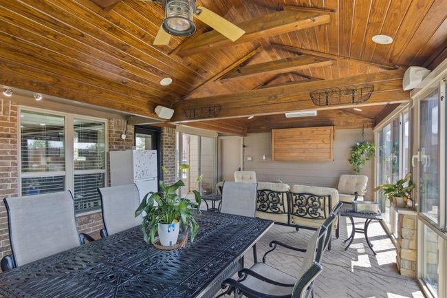 Beautiful enclosed patio with brick floors. | Image 36