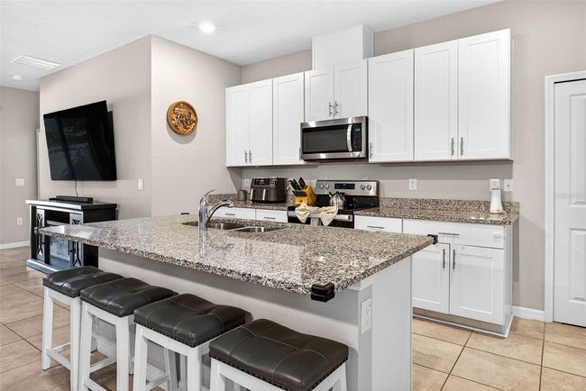 From the kitchen you have immediate access to your dining area and living room. | Image 9