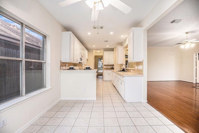 Breakfast room looking toward kitchen and living room. | Image 19