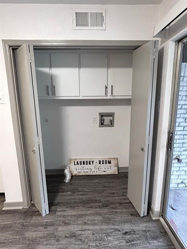 Mudroom with dark wood-type flooring and baseboards | Image 13