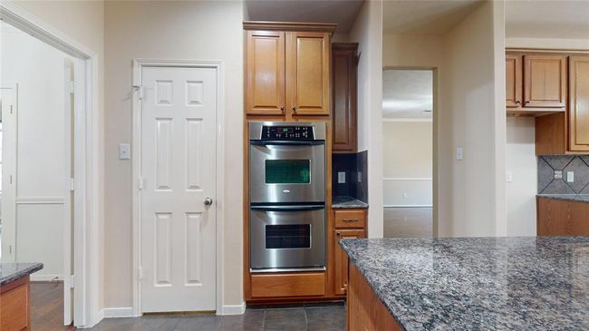 Luxury kitchen featuring a sleek double oven. | Image 14