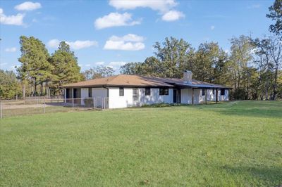 Rear view of house with a lawn | Image 2