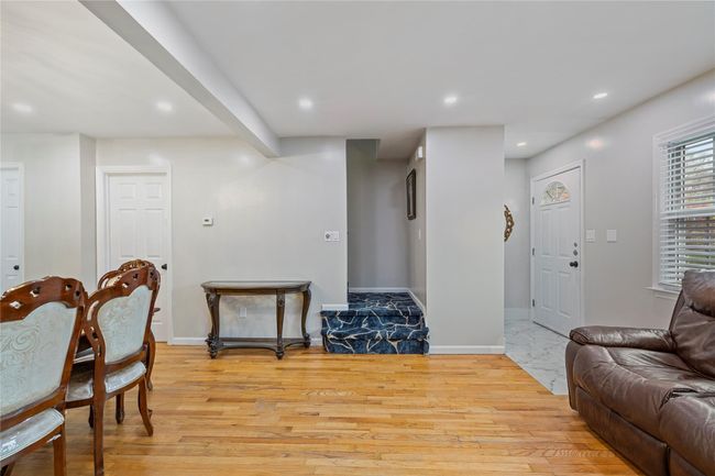Living room with recessed lighting, light wood-style floors, and baseboards | Image 11