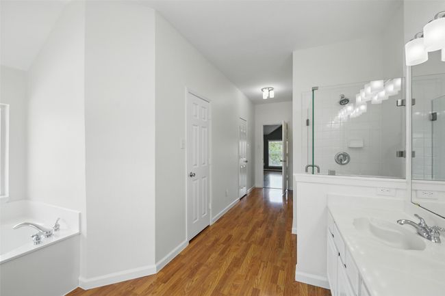 The en-suite has double sinks, seperate tub & shower plus a large walk-in with two doors. | Image 22