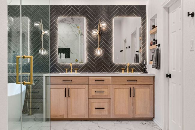 Designer double vanities add luxury and style to the renovated primary bath | Image 20
