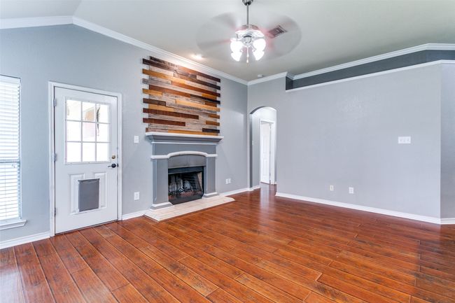 This living room is the heart of the home and a great space for entertaining. | Image 9