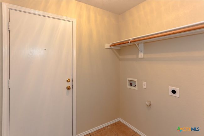 Utility room right off the garage with washer and dryer hook ups | Image 36