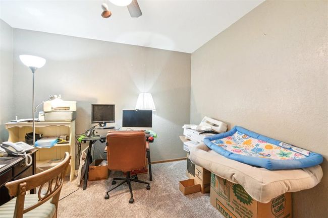 Office area featuring carpet and a ceiling fan | Image 31