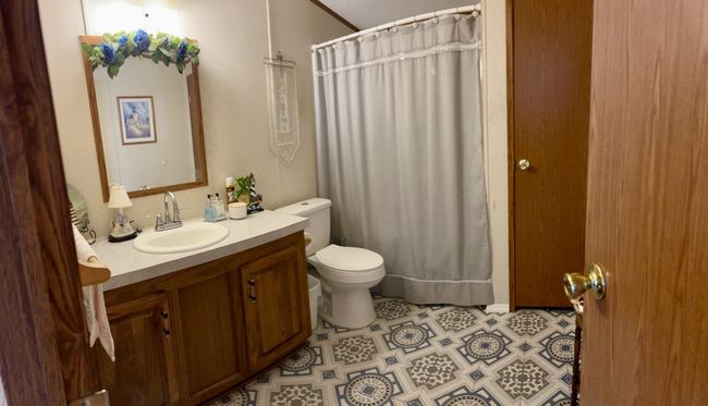 Primary bath with custom tile. | Image 25