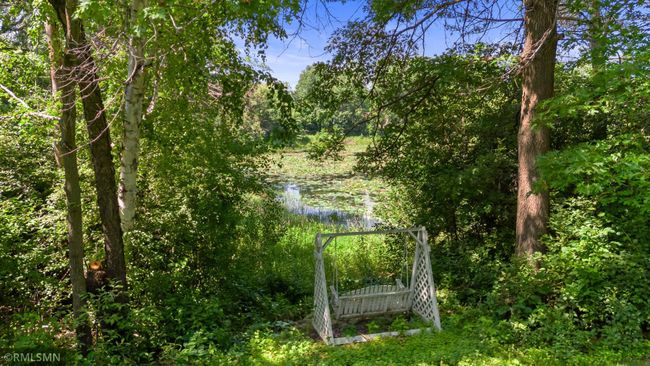 From yard toward pond at the height of summer. Relax on swing or launch your paddle boat or kayak. | Image 79