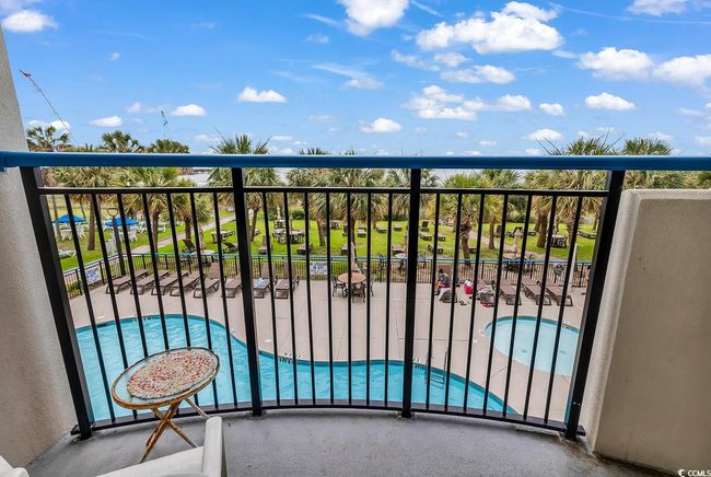 Balcony with view of pool area | Image 4