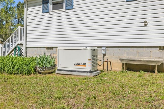 Exterior details featuring a power unit, crawl space, and stairway | Image 31