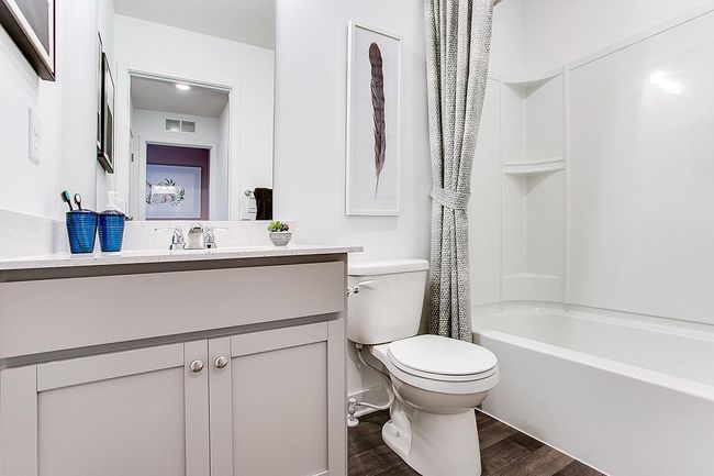 Upstairs secondary bath. Model picture shown. Colors and finishes may vary. | Image 14