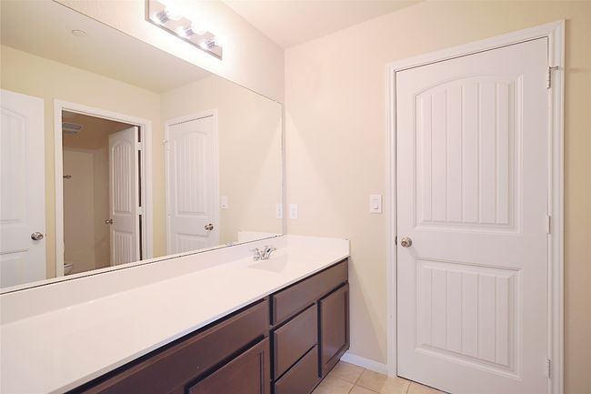 Bathroom with vanity and tile patterned floors | Image 13
