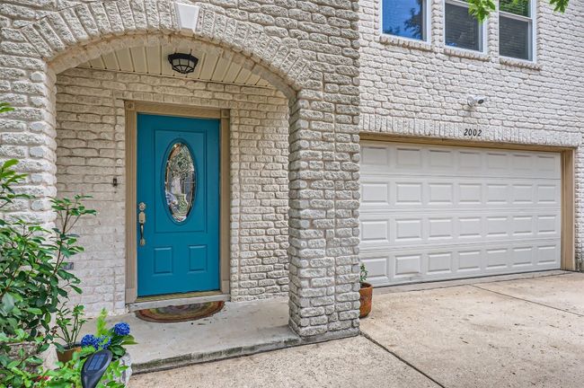 Doorway to property featuring driveway and brick siding | Image 4