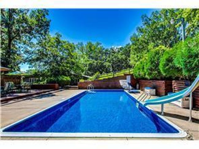 inground heated pool photo provided by previous owner | Image 36